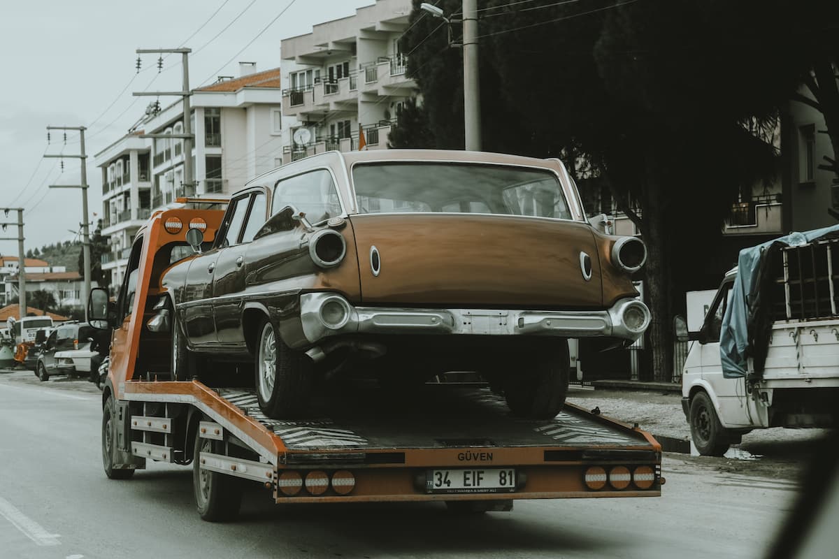 can i sit in my car while it's being towed