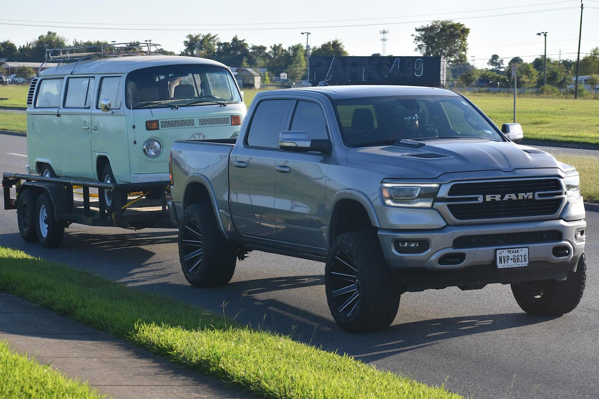 a dodge ram pick up is towing a volkswagen vehicle