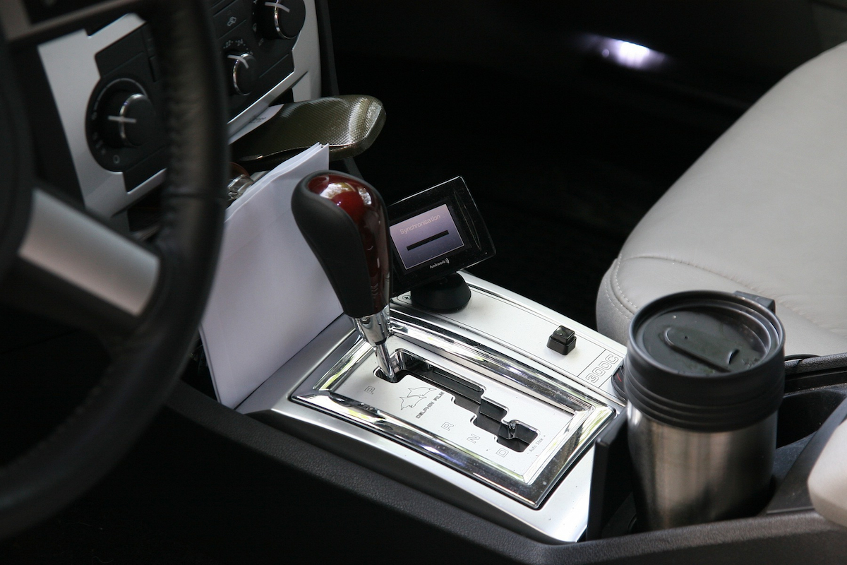 an interior of a car showing a gear shift knob