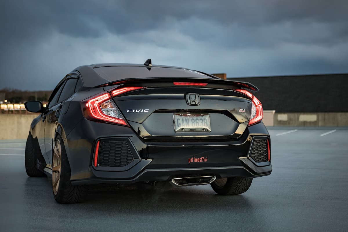 Photo of the back of a black Honda Civic. 