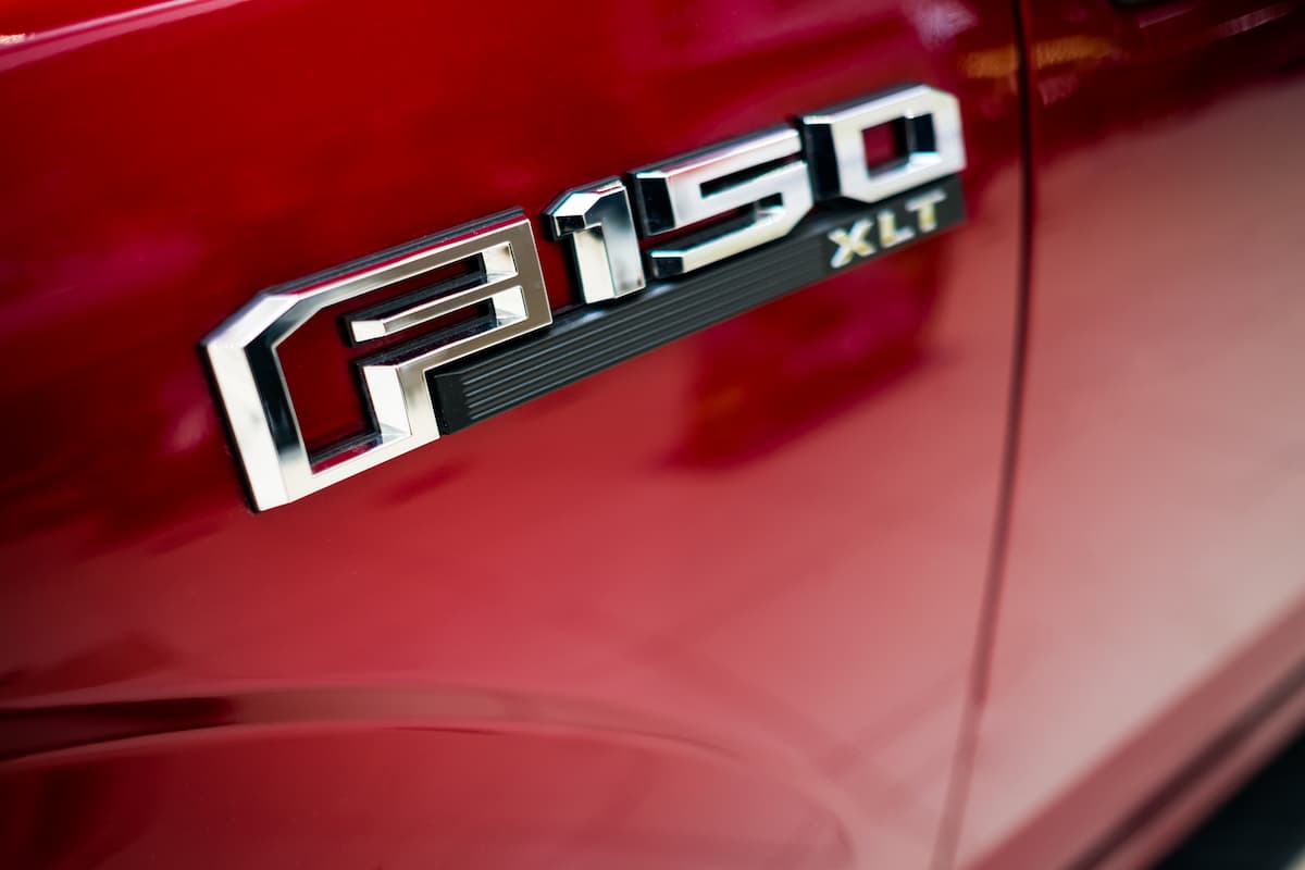 Close-up photo of the logo of Ford F150 pickup truck. 