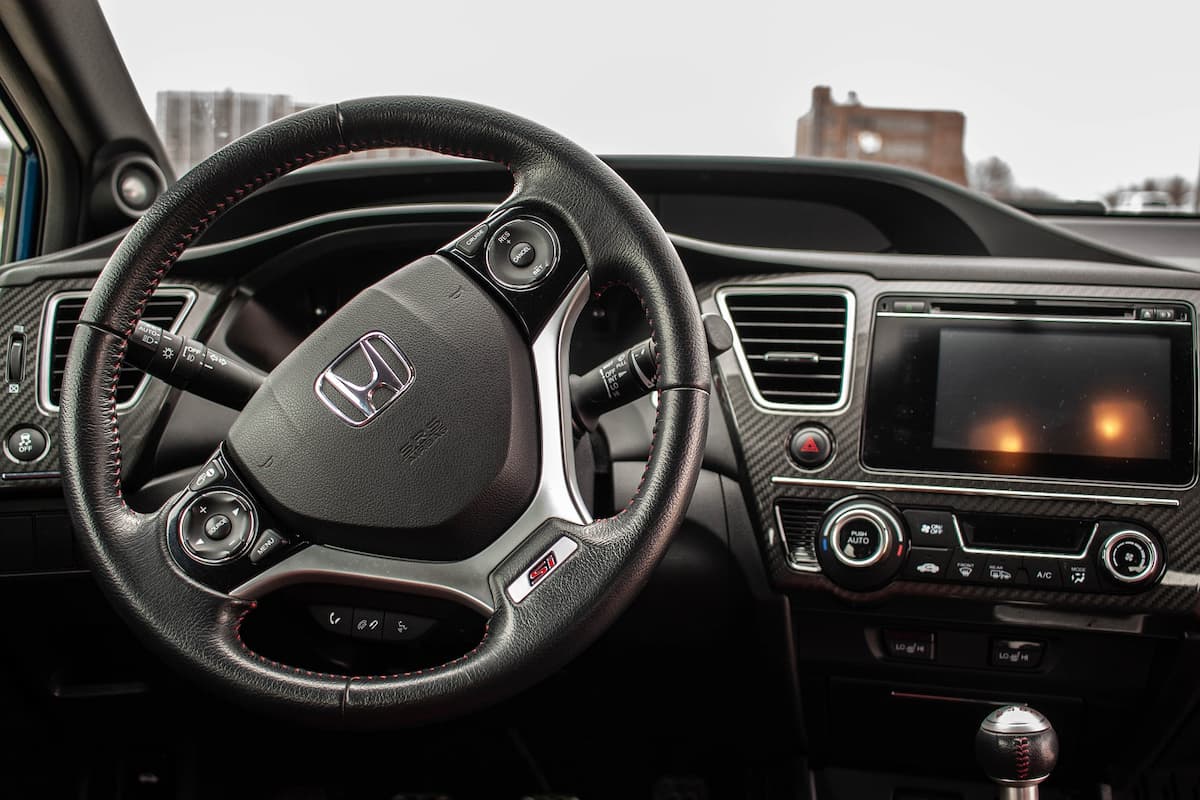 Photo of Honda steering wheel and dashboard.