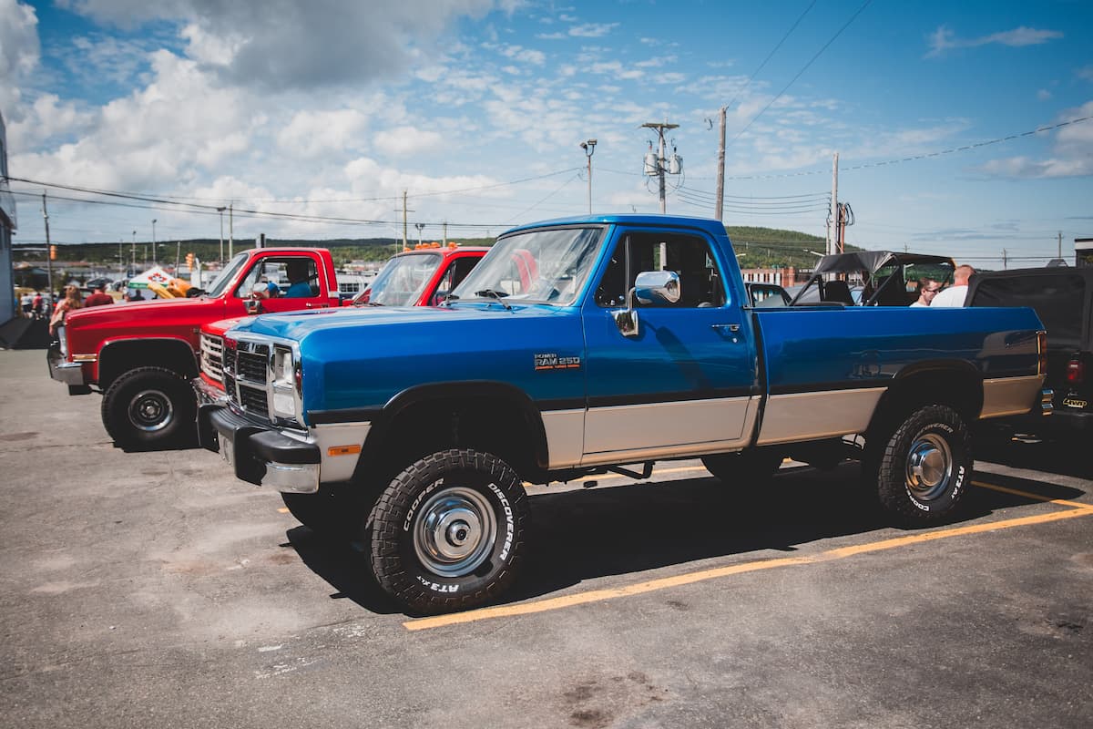 Three pickup trucks parked in the parking lot.