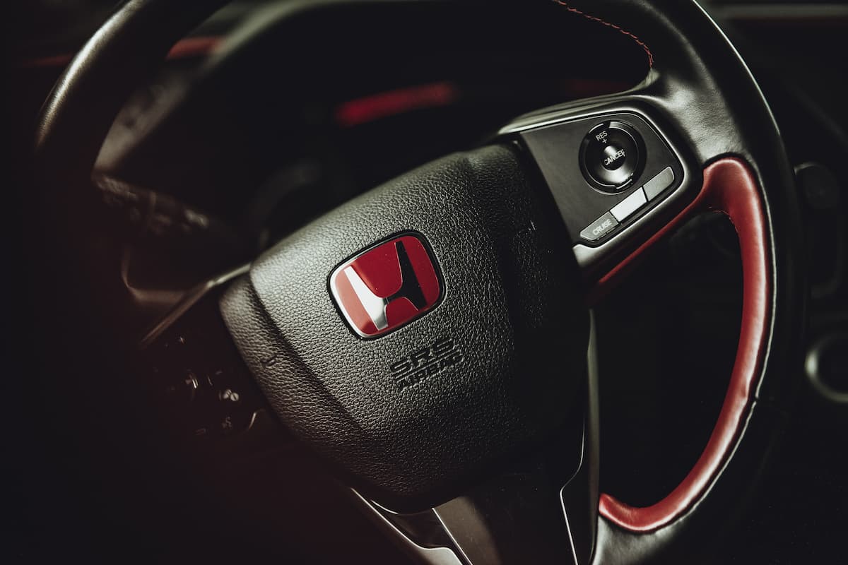 A black and red Honda steering wheel.