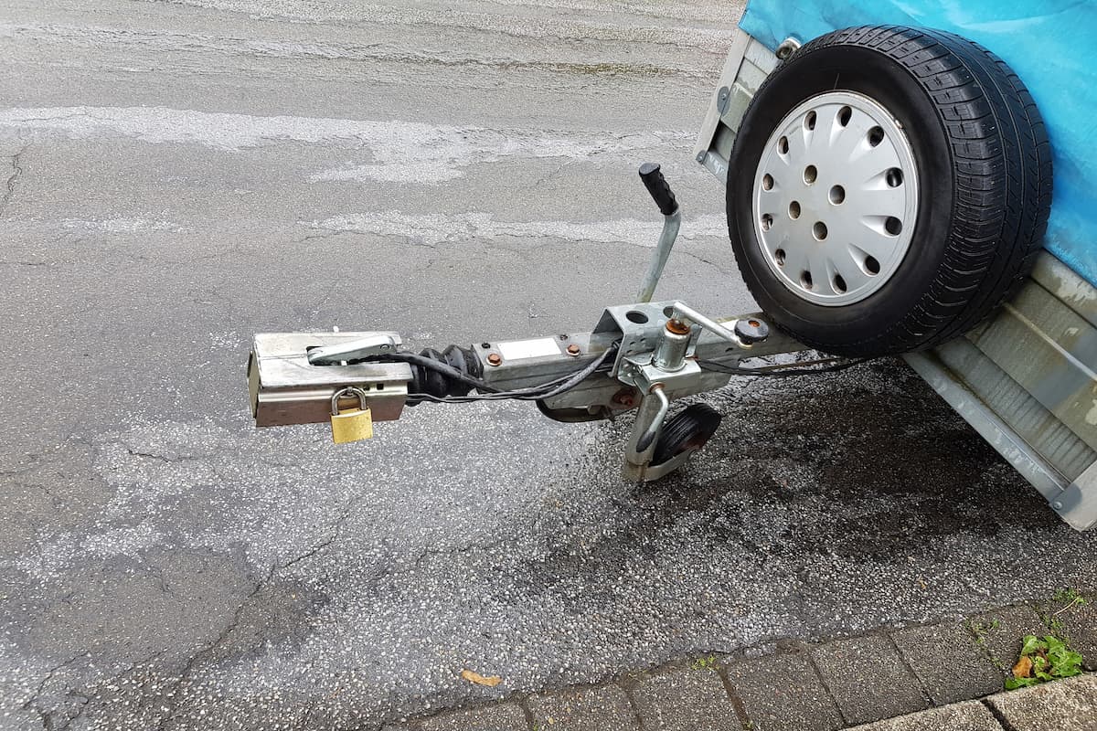Towbar and jockey wheel with power connection and trailer lock.